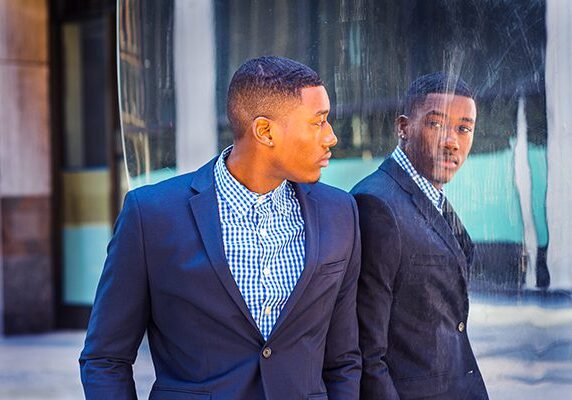 coach looking at his reflection in the chicago bean