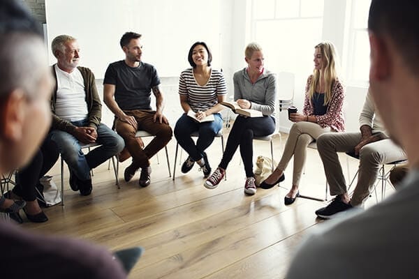 people engaging in a coaching circle session