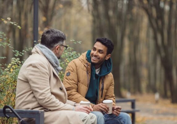 client and coach meeting in a park during a cool day