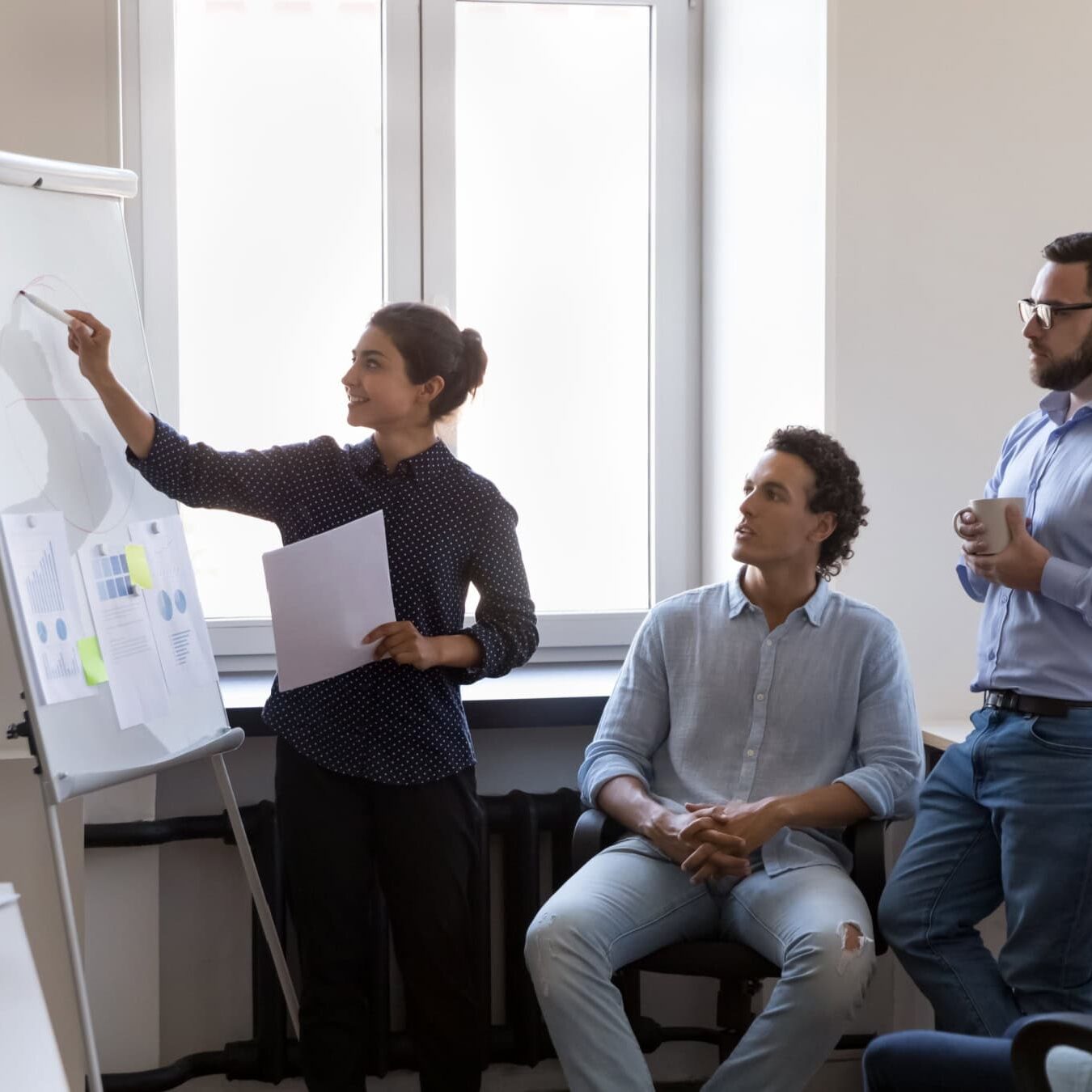 A group goes over performance evaluations to see where they can grow.