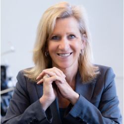 Headshot of Ellen + Kocher, blog author with the International Coaching Federation. Known for being an economist, National Board-Certified Health and Wellness Coach (NBC-HWC), and workplace wellness consultant with a master’s degree in health and wellness coaching.