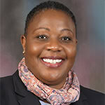 Headshot of Tamala Chirwa, PCC with the International Coaching Federation. Known for coaching C-suite leaders to enhance leadership and team performance.