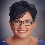 Headshot of Denise Russo, Vice Chair with the International Coaching Federation. Known for talent development, leadership coaching, and career transitions.