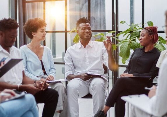 coach speaking during a group coaching session